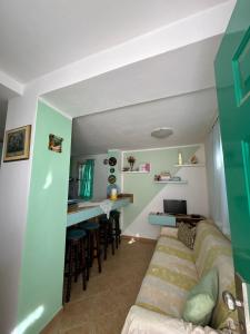 a living room with a couch and a bar at Holiday Home Zenit in Ulcinj