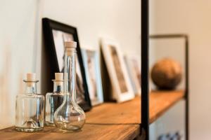a glass vase sitting on top of a wooden shelf at Palau de la Musica Apartments in Barcelona