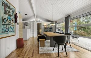 a kitchen and dining room with a table and chairs at Beautiful Home In Ebeltoft With Sauna in Ebeltoft