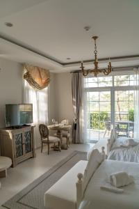 a living room with a bed and a dining room at CastellStay in Campson +22 photos