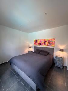 Ένα ή περισσότερα κρεβάτια σε δωμάτιο στο Villa confort avec piscine