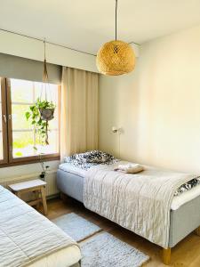 En eller flere senge i et værelse på Apartment Rauha