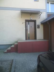 a door on the side of a building at Apartament Konieczki in Ełk