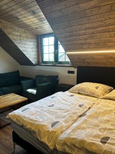 Postel nebo postele na pokoji v ubytování Apartmány Vlachovice