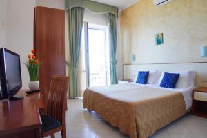 Postel nebo postele na pokoji v ubytování New Hotel Sonia