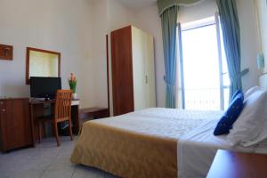 Postel nebo postele na pokoji v ubytování New Hotel Sonia
