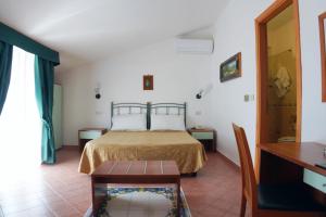 Postel nebo postele na pokoji v ubytování New Hotel Sonia