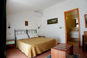 Postel nebo postele na pokoji v ubytování New Hotel Sonia