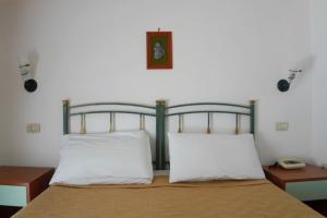 Postel nebo postele na pokoji v ubytování New Hotel Sonia