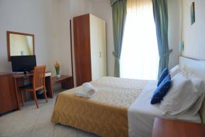 Postel nebo postele na pokoji v ubytování New Hotel Sonia