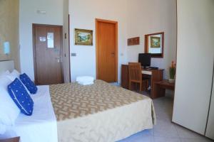 Postel nebo postele na pokoji v ubytování New Hotel Sonia