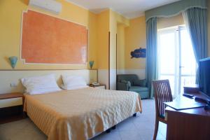 Postel nebo postele na pokoji v ubytování New Hotel Sonia