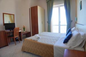 Postel nebo postele na pokoji v ubytování New Hotel Sonia