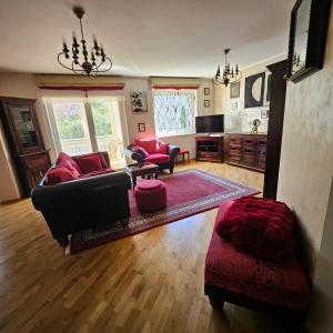 a living room with a couch and a table at Apartament Brownie-Gdynia Orłowo in Gdynia