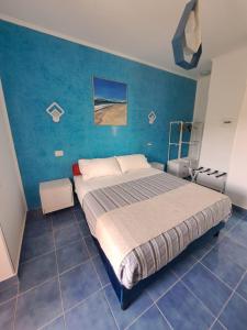 Postel nebo postele na pokoji v ubytování B&B Oasi al Mare