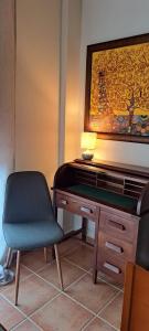 a desk with a chair and a lamp on it at La Casa del Olivo en Montserrat - Valencia in Valencia
