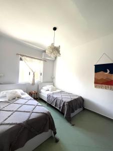 Postelja oz. postelje v sobi nastanitve Seaside Cottage with Garden