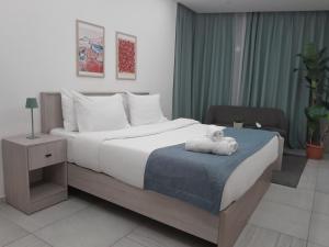 Letto o letti in una camera di Shade Suites & Studios