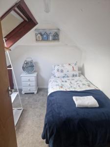 Postel nebo postele na pokoji v ubytování The Nest Carnlough