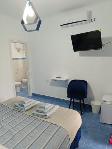 TV a/nebo společenská místnost v ubytování B&B Oasi al Mare