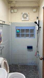 a bathroom with a toilet and a sink at Chubbi5 room11 in Bangkok