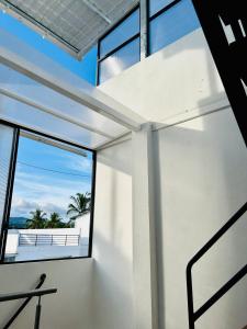 a room with a window and a view of the ocean at Family-friendly with balcony and terrace in Puerto Ayora