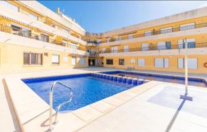 a large swimming pool in front of a building at Apartamento en Moraira Centro con Piscina in Moraira