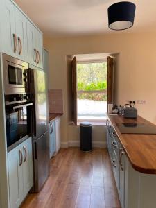 Kuchyň nebo kuchyňský kout v ubytování Kylemore House Boutique Apartments - Nancy's Drift