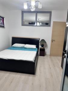 Postel nebo postele na pokoji v ubytování Apartament Arena 2