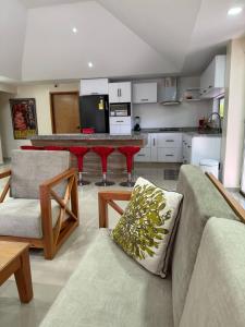 a living room with a couch and a table at casa campo in Estación El Salto