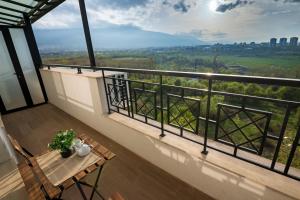a balcony with a table and a view at Brand New Luxury Apartments with Great Views in Sofia