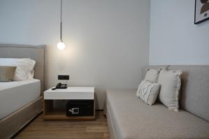 Postel nebo postele na pokoji v ubytování Asters Hotel