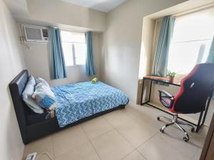 Postel nebo postele na pokoji v ubytování Kler Garden Condo at IT Park + 23 fotografií