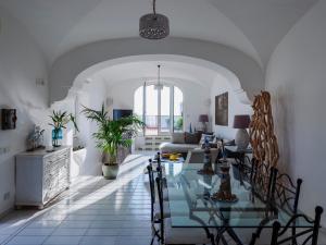 a living room with a table and a couch at Villa Giulia in Praiano