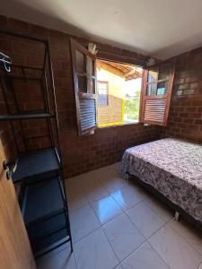a room with a bed and a ladder and windows at Casa em condomínio - 8 pessoas - Gravatá-PE in Gravatá +26 photos