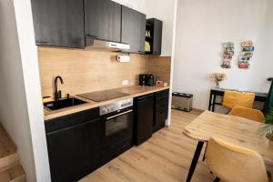 Kuchyň nebo kuchyňský kout v ubytování JS Design Apartment