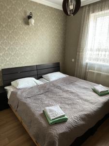 A bed or beds in a room at Guest house chavchavadze N23