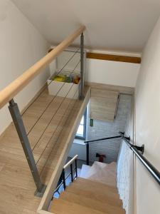 a staircase in a house with wooden floors at Cozy vintage BNB house in Yerville