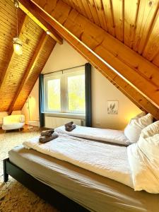 a bedroom with a large bed in a house at Ferienhaus an der Schlei in Kappeln