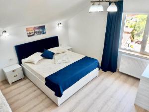 Postel nebo postele na pokoji v ubytování Vila Coty