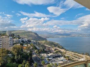 a view of a city and a body of water at חלום מול נוף הכנרת in Tiberias