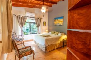 Postel nebo postele na pokoji v ubytování Villa Tortuga + 37 fotografií