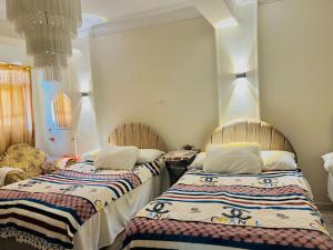 Postel nebo postele na pokoji v ubytování Savor Star pyramids hotel