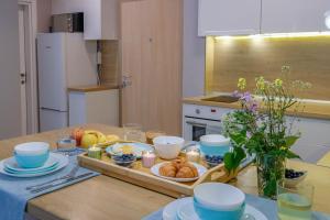 Kuchyň nebo kuchyňský kout v ubytování Breeze Sunny apartment + 37 fotografií