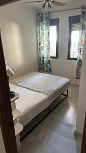 En eller flere senge i et værelse på Green By The Bay - La Herradura