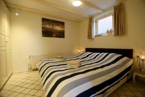 Ένα ή περισσότερα κρεβάτια σε δωμάτιο στο Bungalow Callantsoog