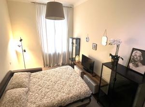 En eller flere senge i et værelse på Livraghi3 Cozy Apartment