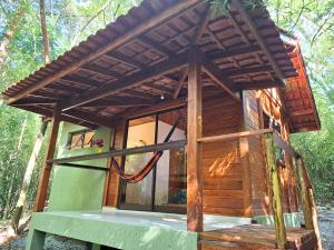 Φωτογραφία από το άλμπουμ του Cabana de madeira entre as árvores σε Piedade