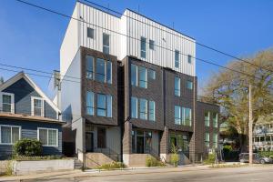 a large brick building on a city street at Squire - Prime Location with View & Parking in Seattle