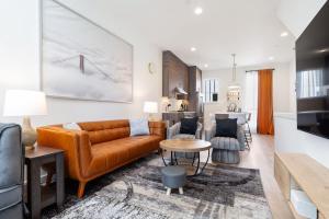 a living room with a couch and a table at Squire - Prime Location with View & Parking in Seattle